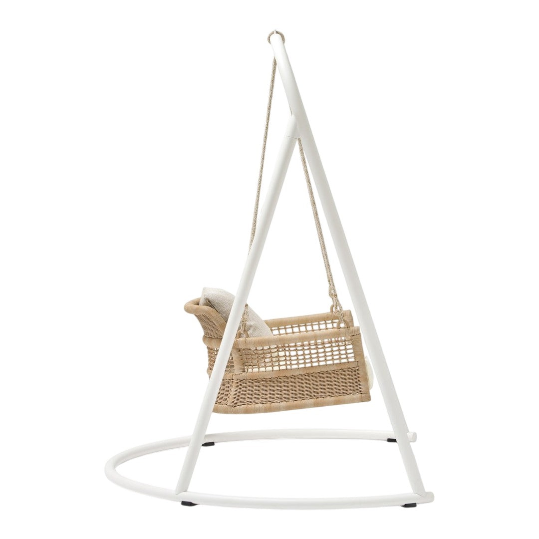 White metal frame with natural rattan swing chair, featuring a neutral cushion for added comfort.