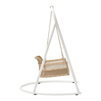 Natural rattan swing chair with a sleek white frame, perfect for modern decor. Minimalist design with neutral tones.