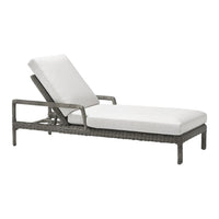 Gray wicker lounge chair with white cushions, featuring a modern design and adjustable backrest for outdoor comfort.
