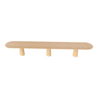 Light wood shelf with smooth, rounded edges and three cylindrical legs, showcasing a natural finish.