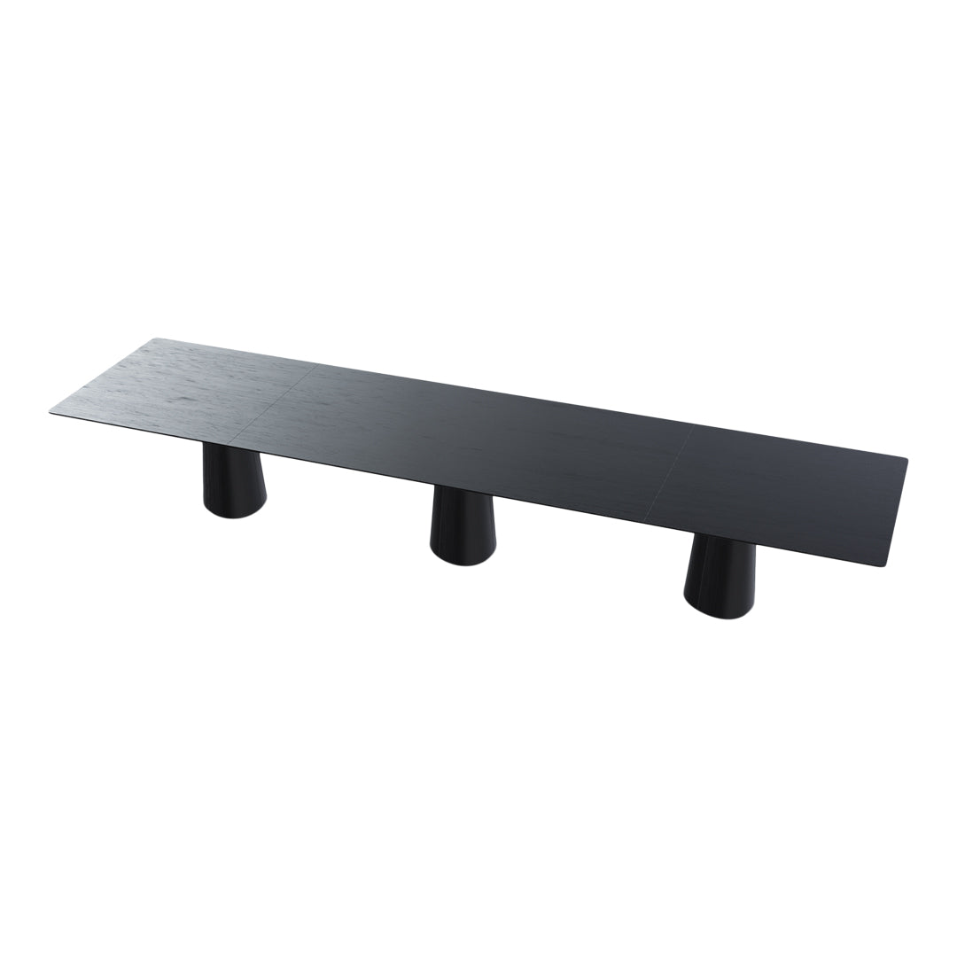 Black minimalist bench with a smooth surface and three cylindrical legs, showcasing a modern, sleek design.