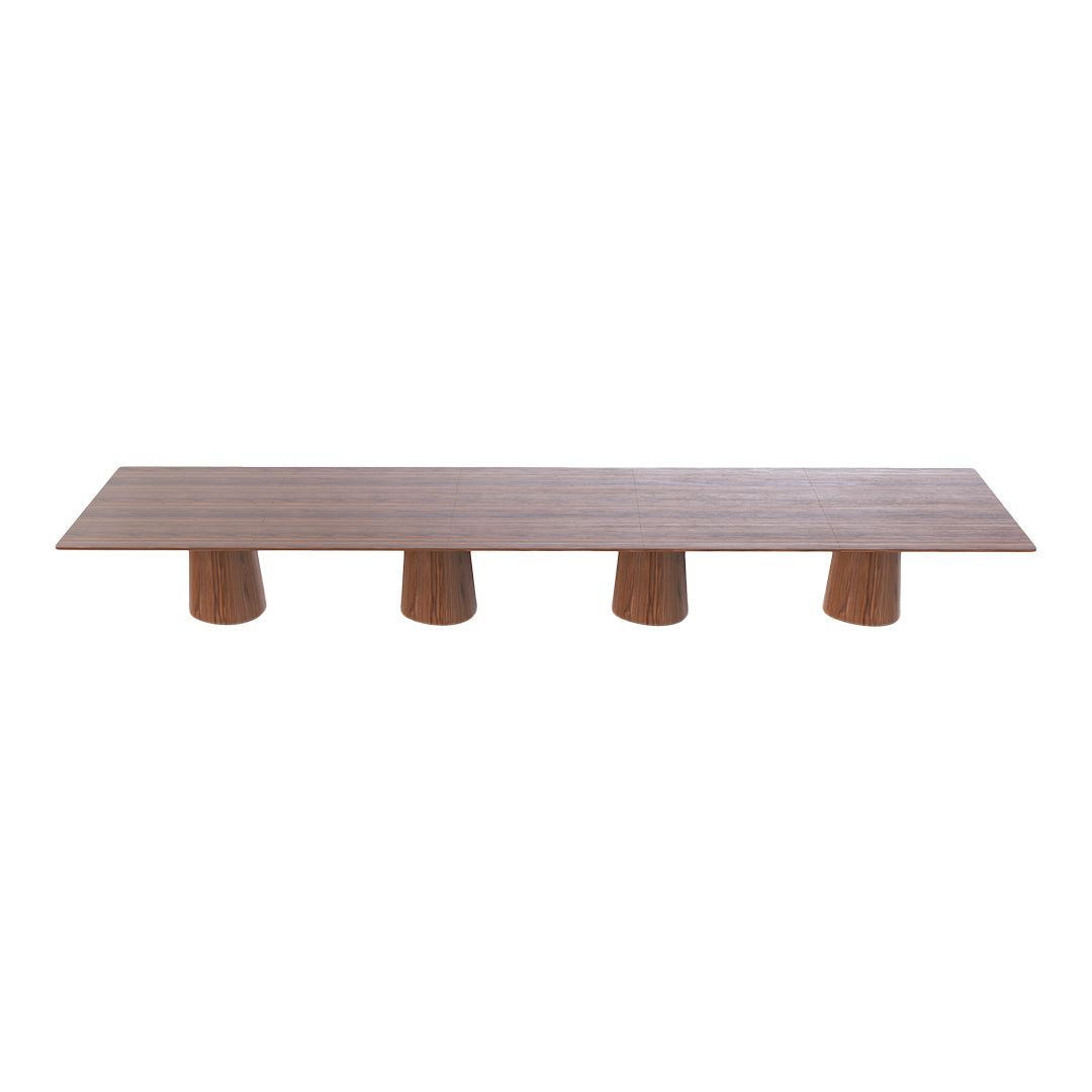 Long wooden table with a smooth, natural finish and four textured cylindrical legs in a warm wooden tone.