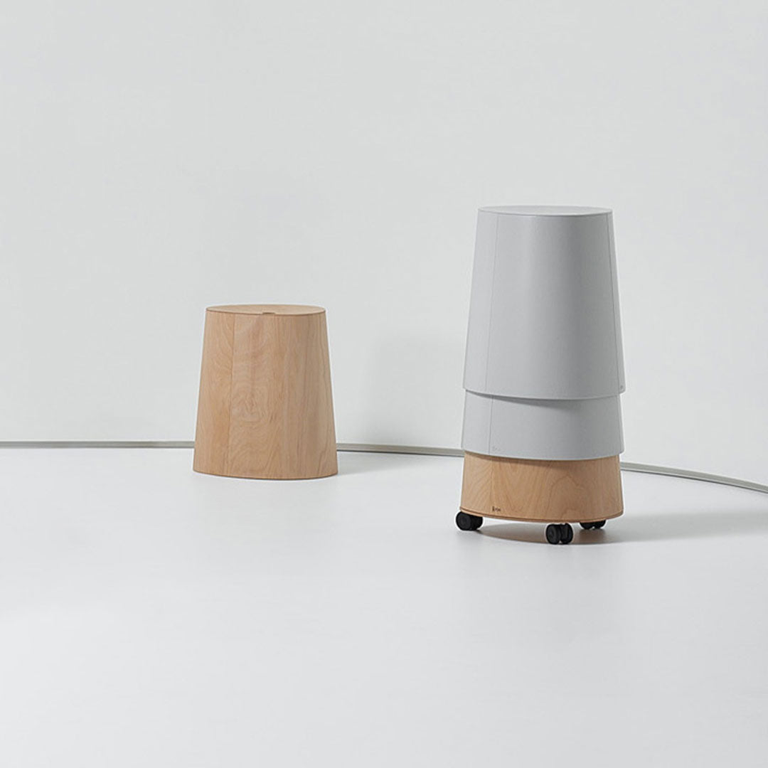 Modern gray and wooden storage stools with a sleek, minimalist design, perfect for contemporary interiors.