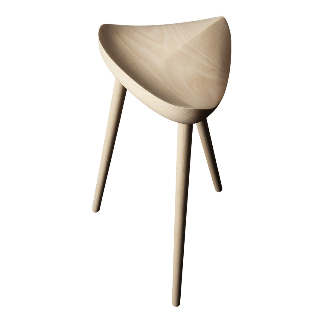 Light natural wood stool with a smooth, curved seat and tapered legs, showcasing a minimalist design and neutral tones.