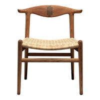 Natural wood chair with a light brown finish and a woven pattern seat in beige tones.
