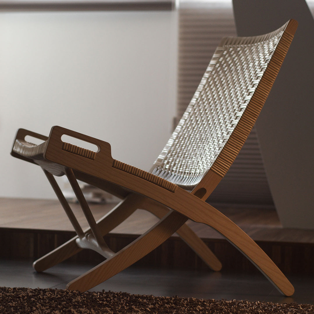 Stylish woven lounge chair in natural wood tones with a sleek, minimalist design and light-colored mesh pattern.