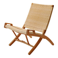 Natural woven rattan chair with a light brown wood frame and a textured, honey-colored seat. Modern and minimalist design.