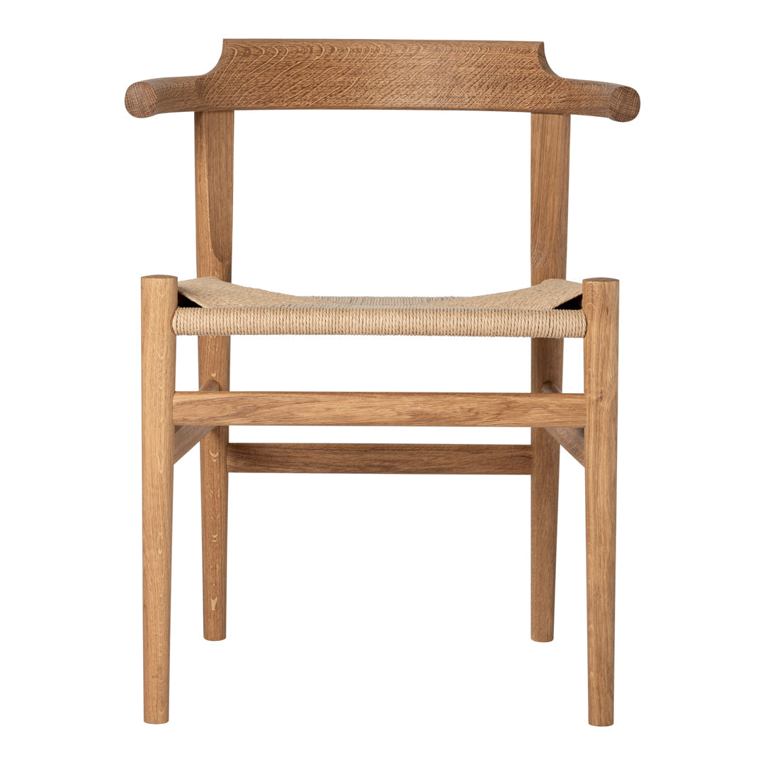 Natural wood chair with a minimalist design, featuring a warm oak finish and woven natural seat.