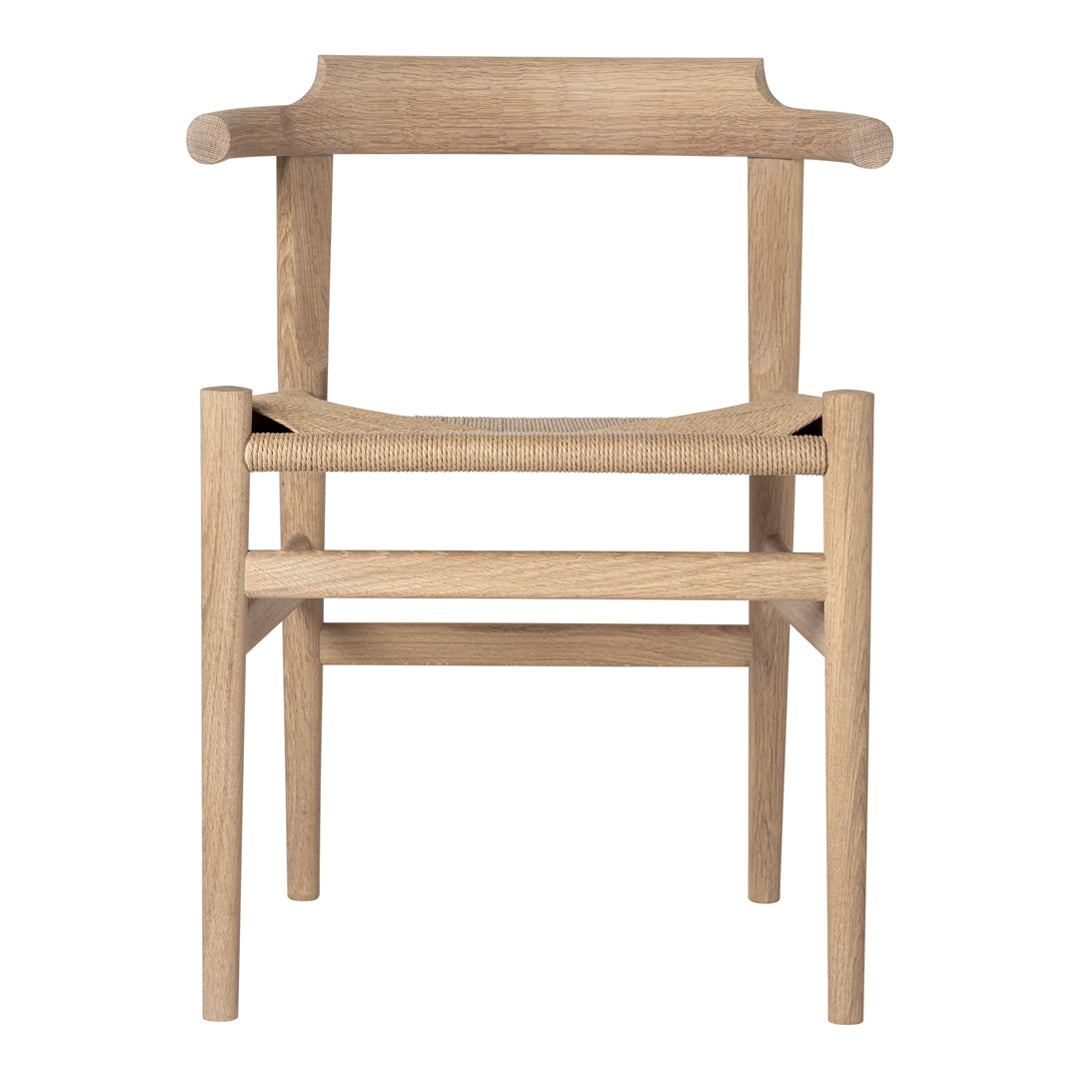 Natural wood chair with light oak finish and minimalist design, featuring clean lines and subtle textures.