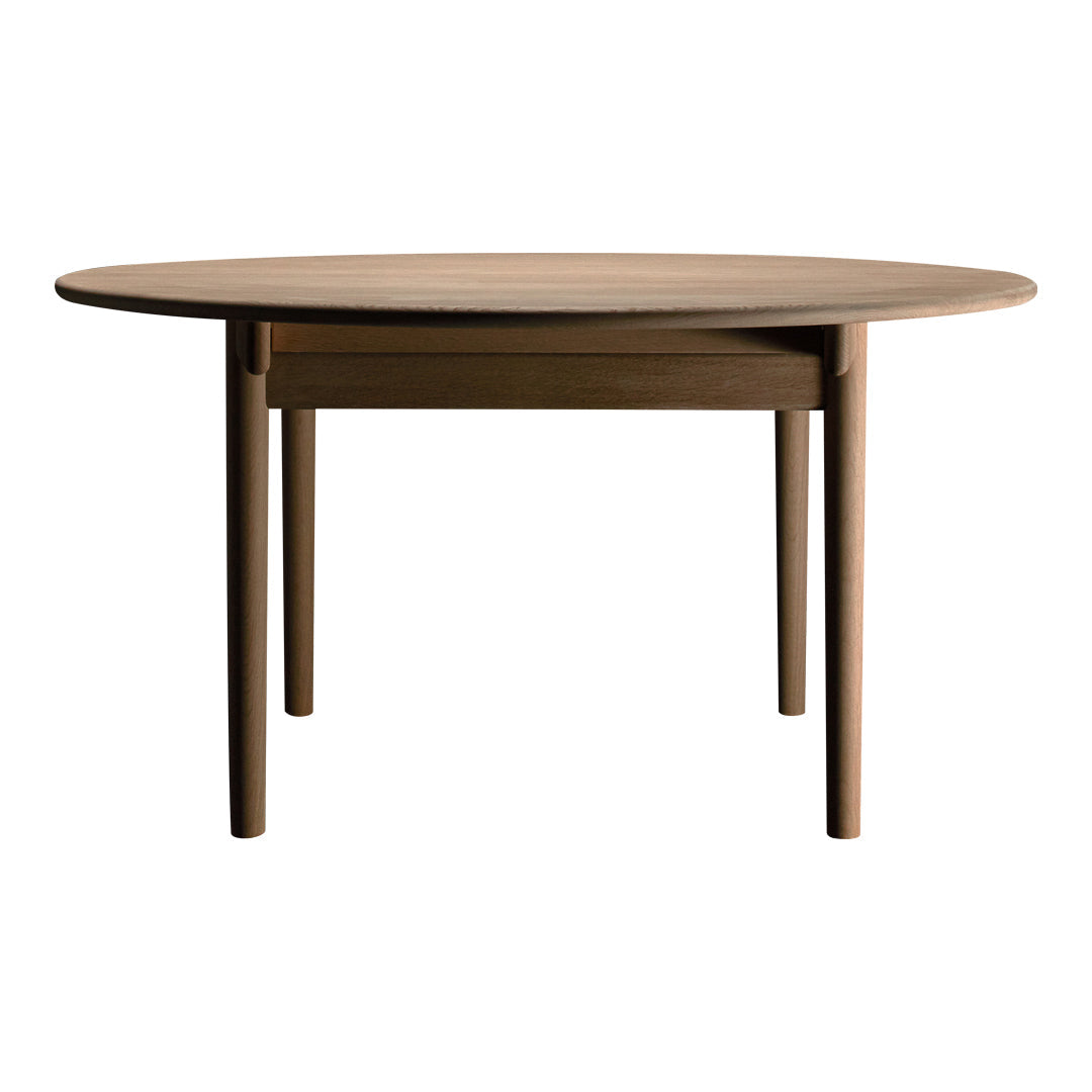 Round wooden table with a smooth, natural finish and minimalist design in warm brown tones. Perfect for modern spaces.