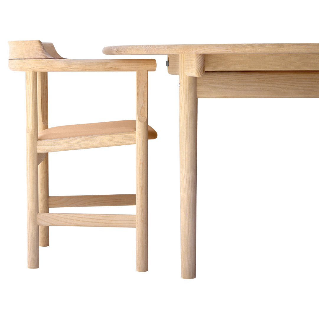 Light natural wood chair with a minimalist design, featuring smooth lines and a seamless finish. Perfect for modern decor.