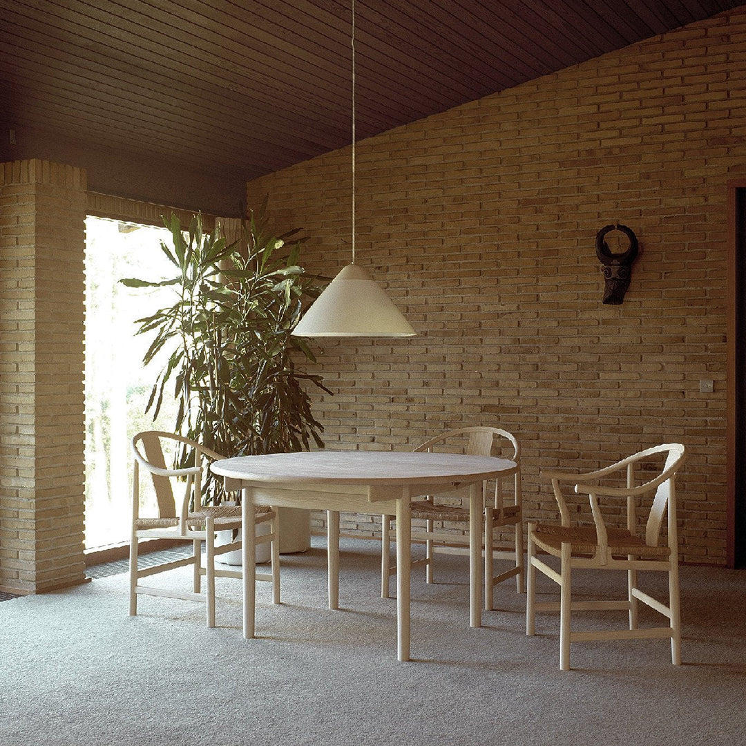 Modern beige dining set with clean lines, minimalist design, and natural wood tones, complemented by soft lighting.