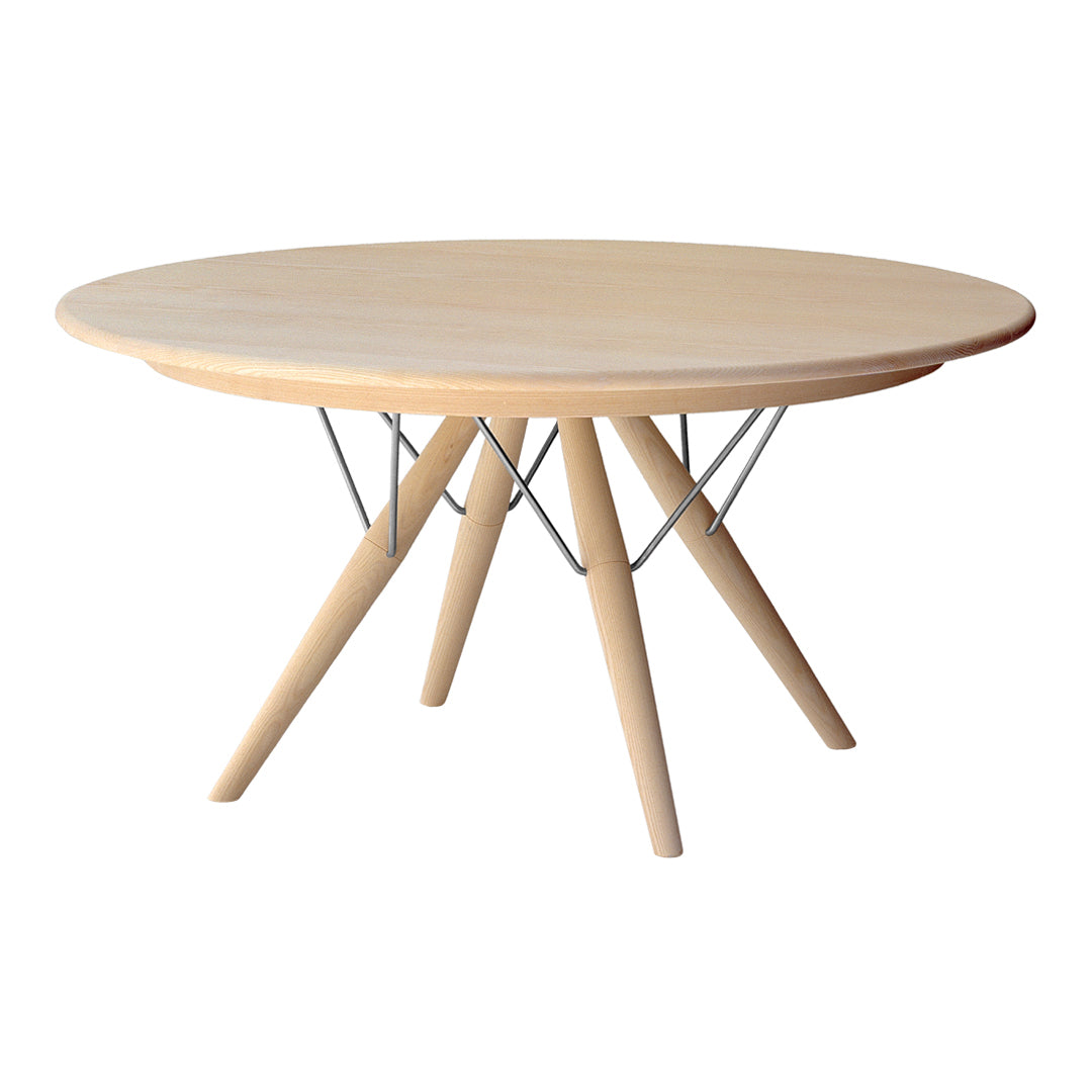 Round wooden table with a natural light finish and sleek metallic wire base, featuring a minimalist design.