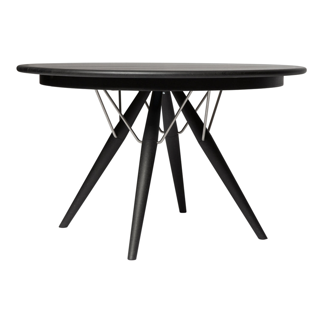 Black round dining table with a geometric wire design and tapered wooden legs. Sleek modern aesthetic perfect for any decor.