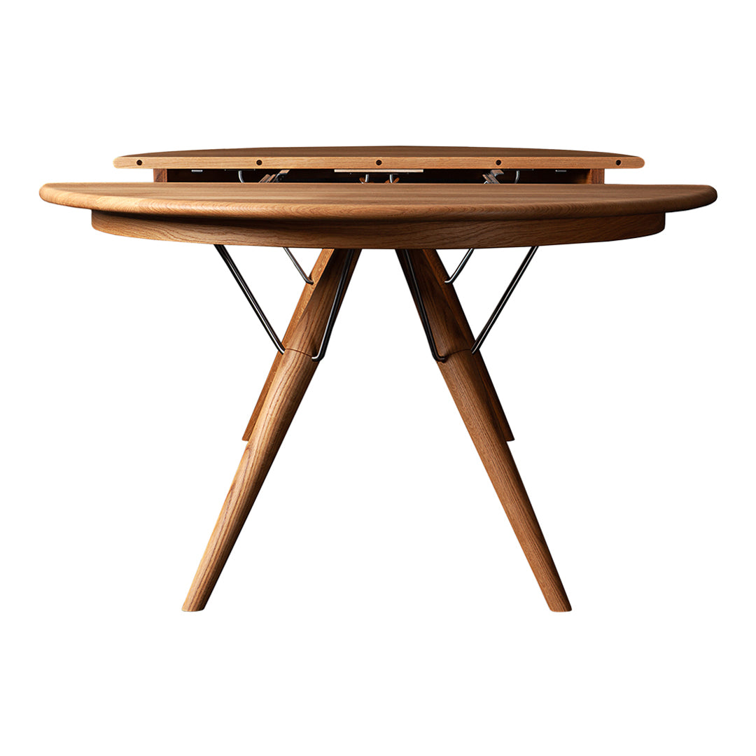 Natural wood-toned round table with a smooth finish and sleek, modern design, featuring tapered legs and minimalist style.