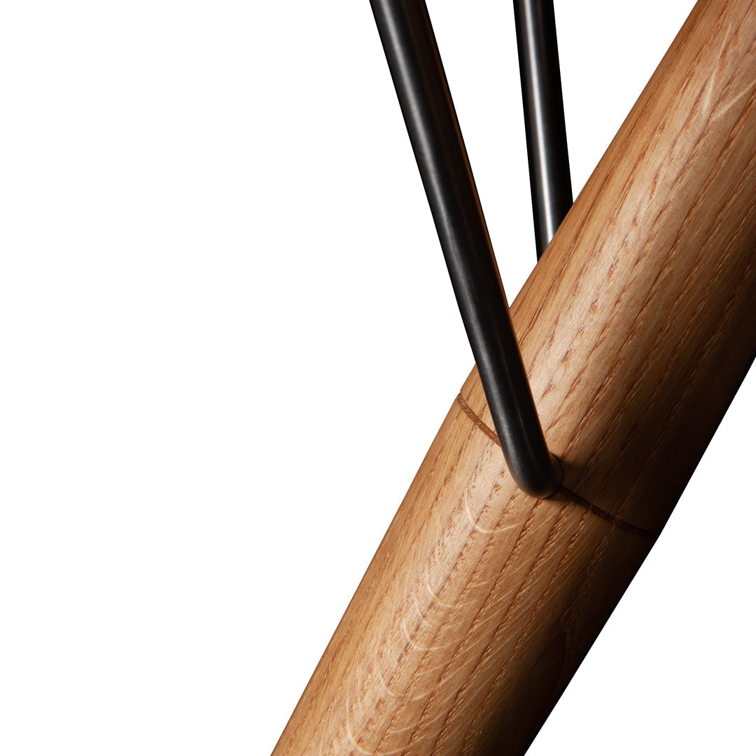 Wooden base with a smooth light wood finish, contrasted by sleek black metal accents and clean lines.