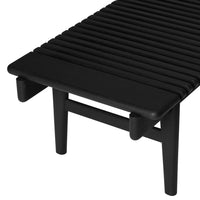 Sleek black slatted design with smooth edges and sturdy legs, perfect for modern decor.
