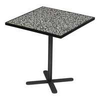 Square table with a speckled black and white patterned top and a minimalist black metal base.