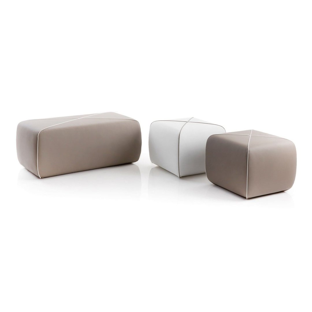 "Rectangular poufs in soft beige and sleek white leather with smooth, minimalist design and subtle stitching."