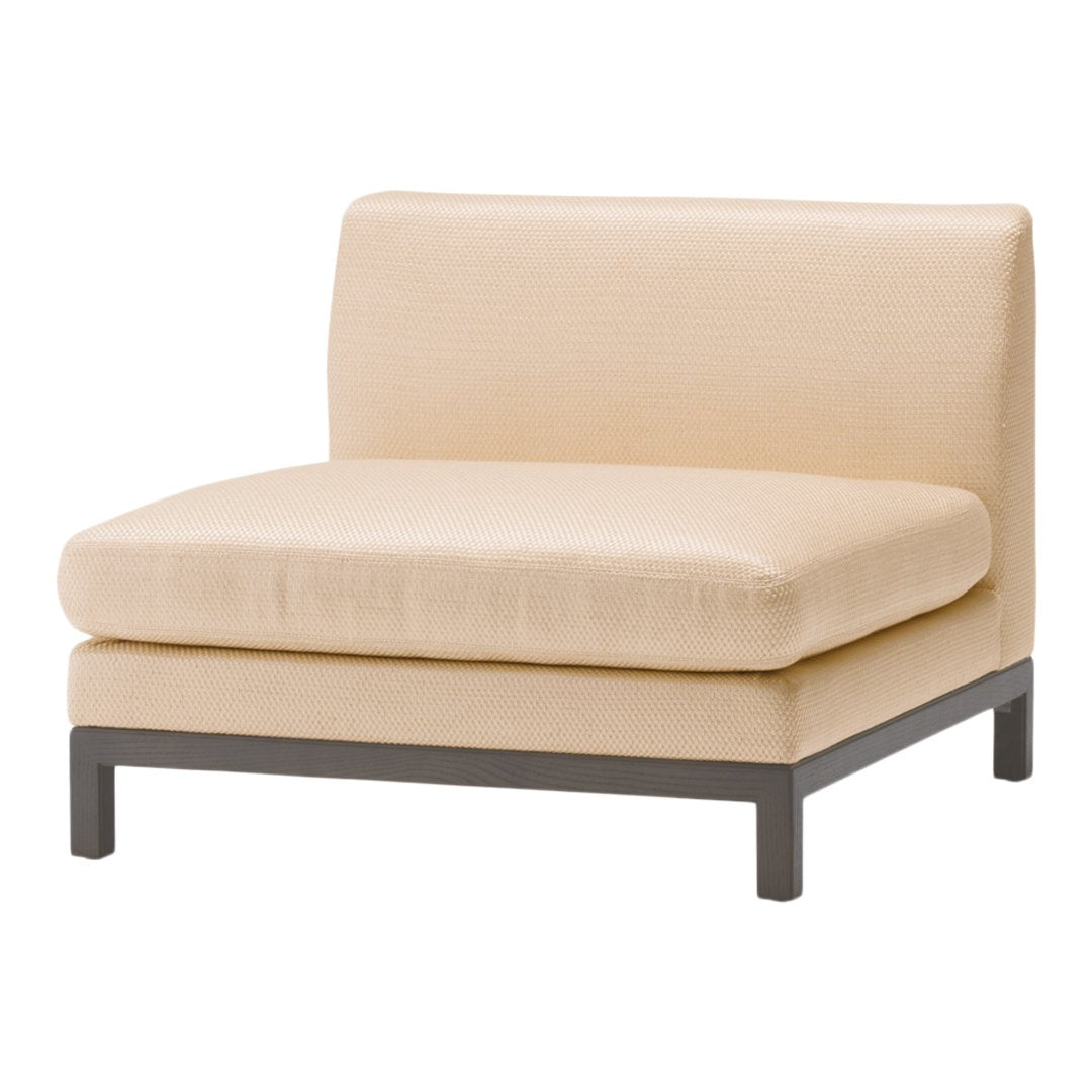 Cream-colored upholstered chair with a minimalist design and smooth texture, featuring a sleek gray metal frame.