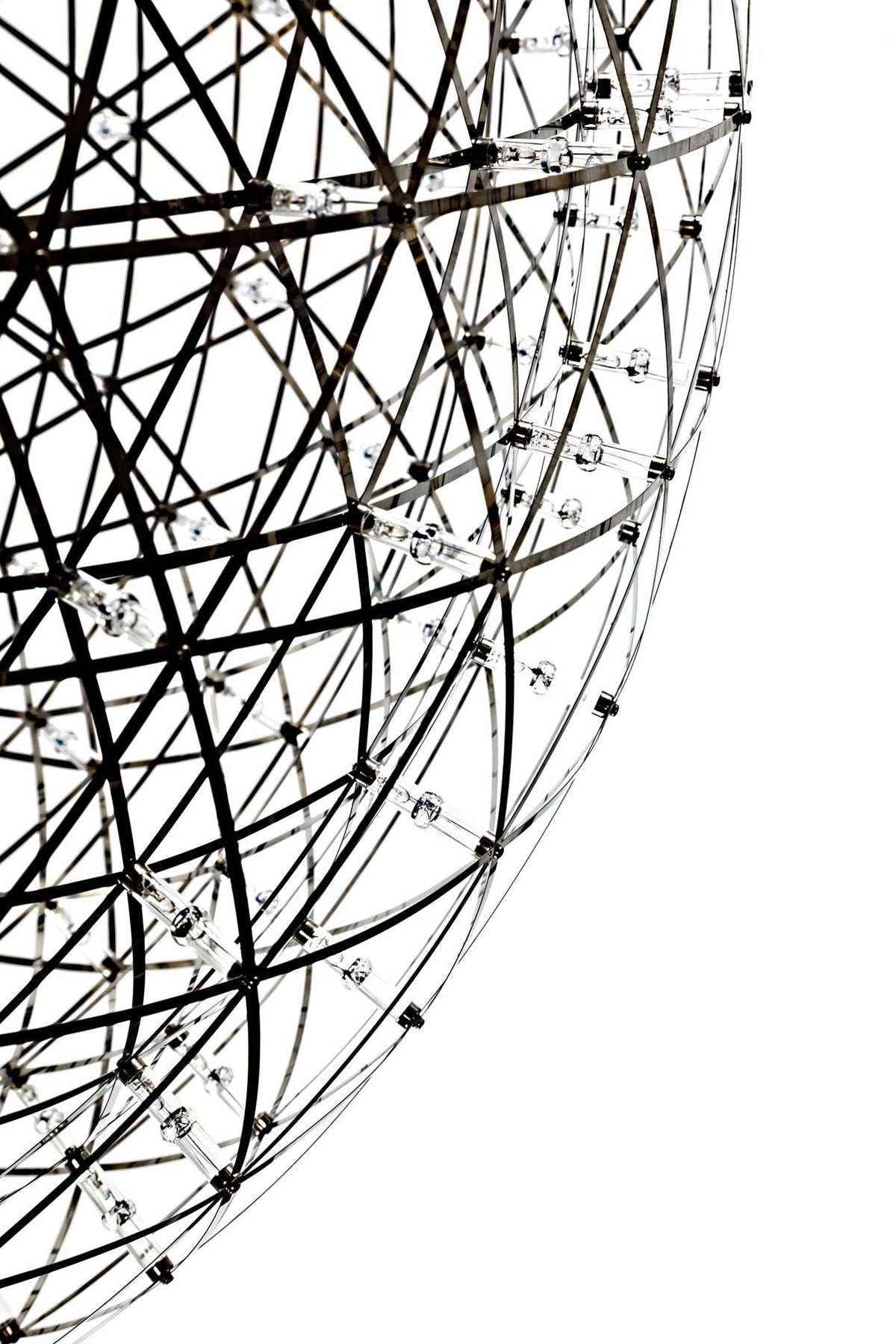 Black and silver geometric sphere with intricate wire patterns and crystal accents. Perfect for modern decor.