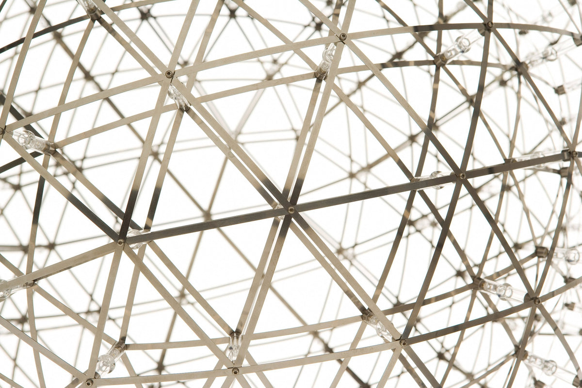 Abstract geometric pattern in black and white with intersecting lines creating a spherical network design.