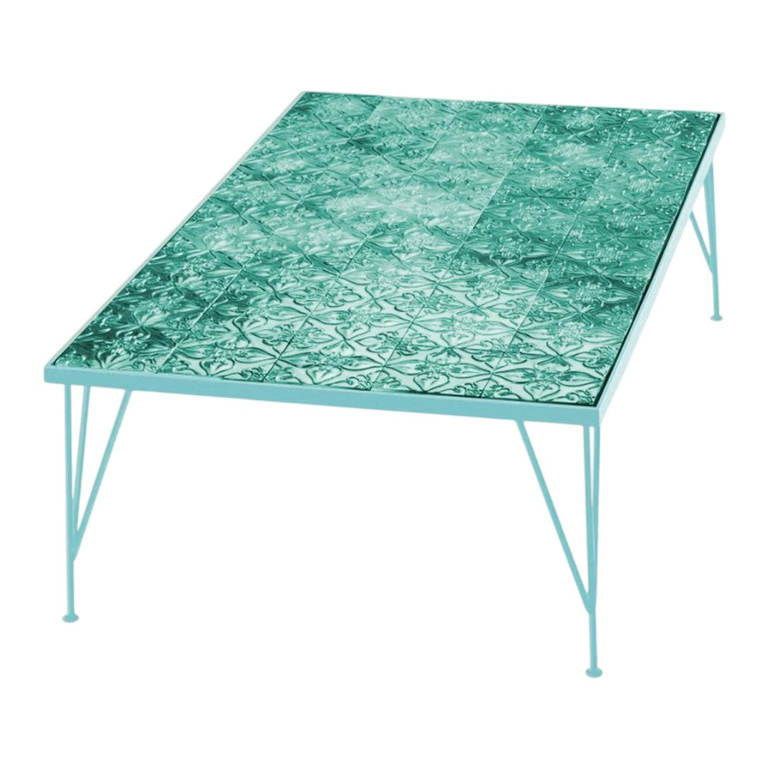 Teal patterned tabletop with intricate designs and light blue legs, perfect for modern decor.