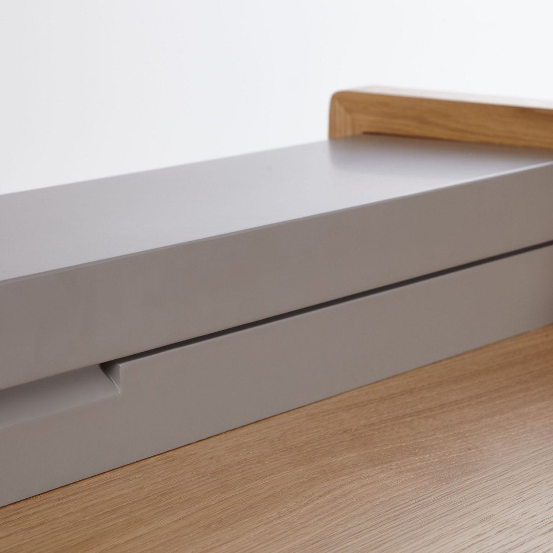 Gray and natural wood tones create a sleek, modern contrast, showcasing minimalistic design elements.