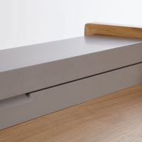 Gray and natural wood tones create a sleek, modern contrast, showcasing minimalistic design elements.