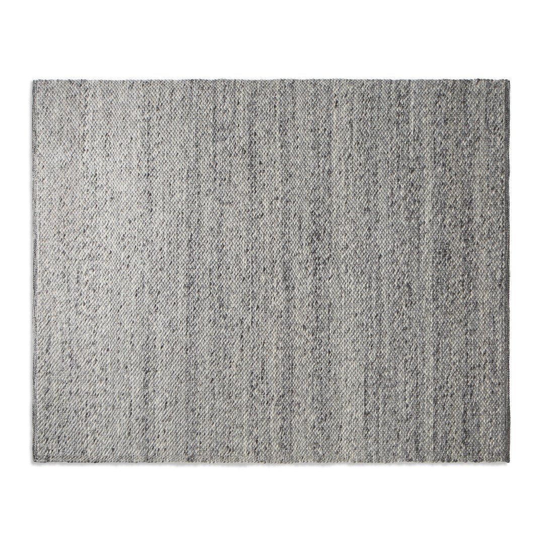 Gray area rug with a subtle linear pattern, featuring varying shades for a textured, modern look.
