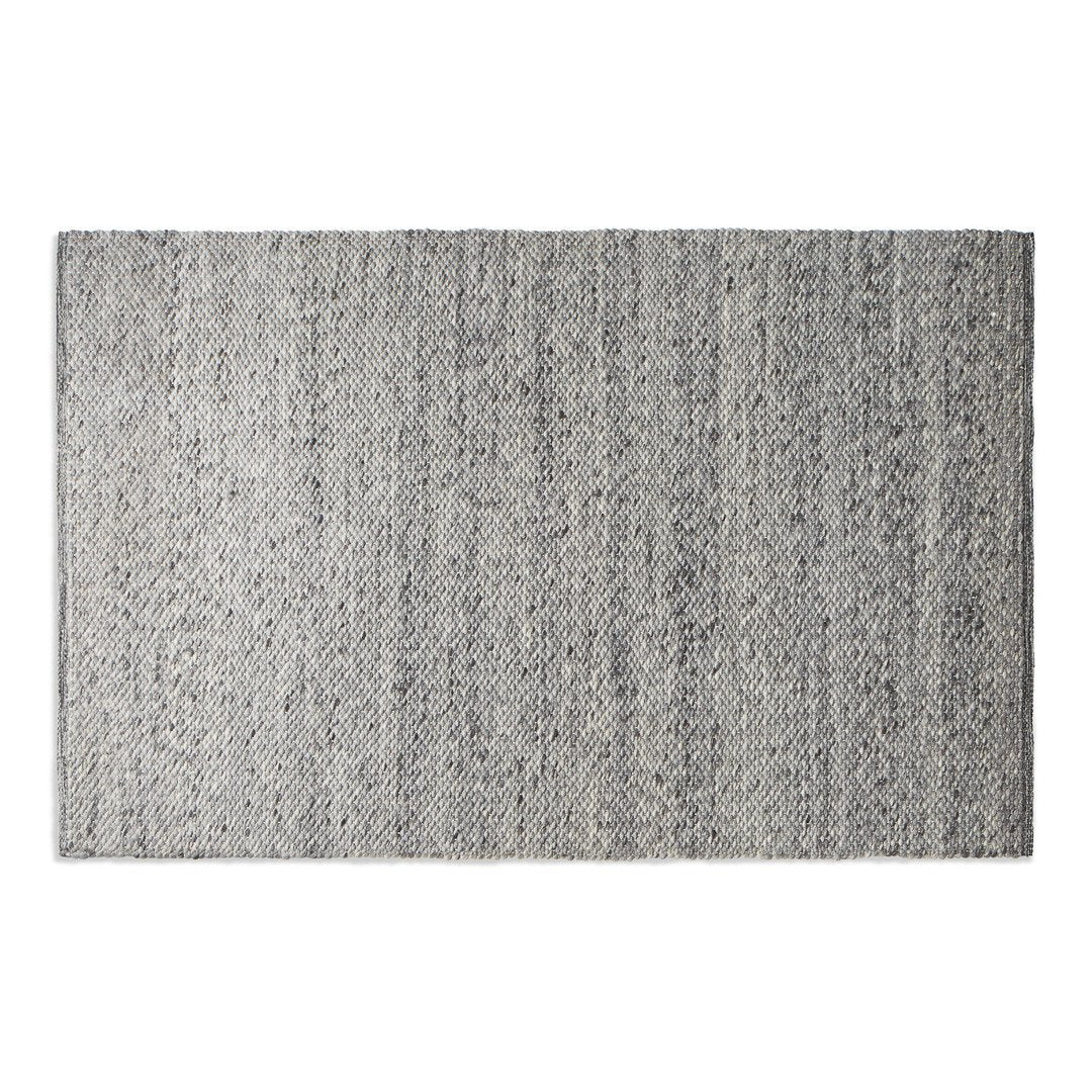Gray woven rug with a subtle linear pattern for a modern touch. Ideal for contemporary home decor.