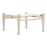 Cream-colored wooden stool with a smooth finish and simple, patterned legs. Ideal for versatile home decor.