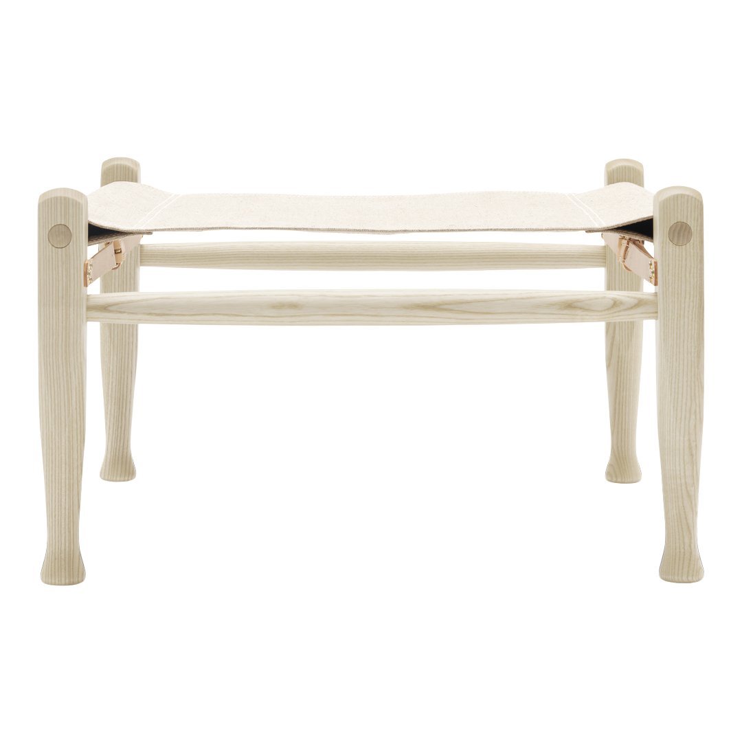 Light wooden bench with a smooth, cream-colored fabric seat, featuring a minimalist design and elegant finish.