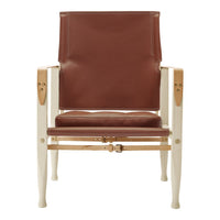 Brown leather chair with a smooth finish and light wooden frame. Simple, modern design with clean lines.
