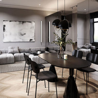 Modern dining room featuring gray walls, a black table, and black chairs, accented by light wood flooring and abstract art.