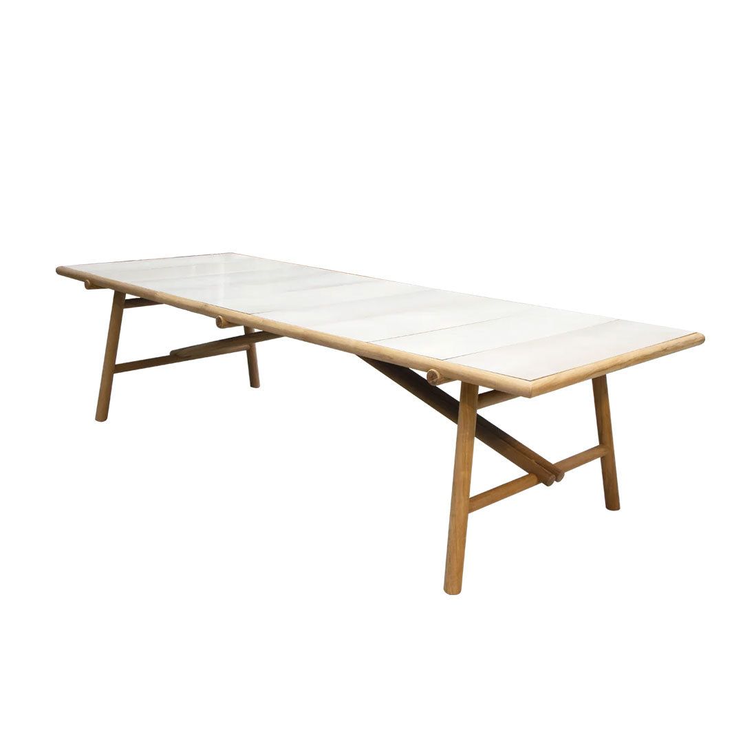 White rectangular table with a smooth surface and natural wooden legs, featuring a minimalist design.
