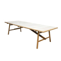 White rectangular table with a smooth surface and natural wooden legs, featuring a minimalist design.