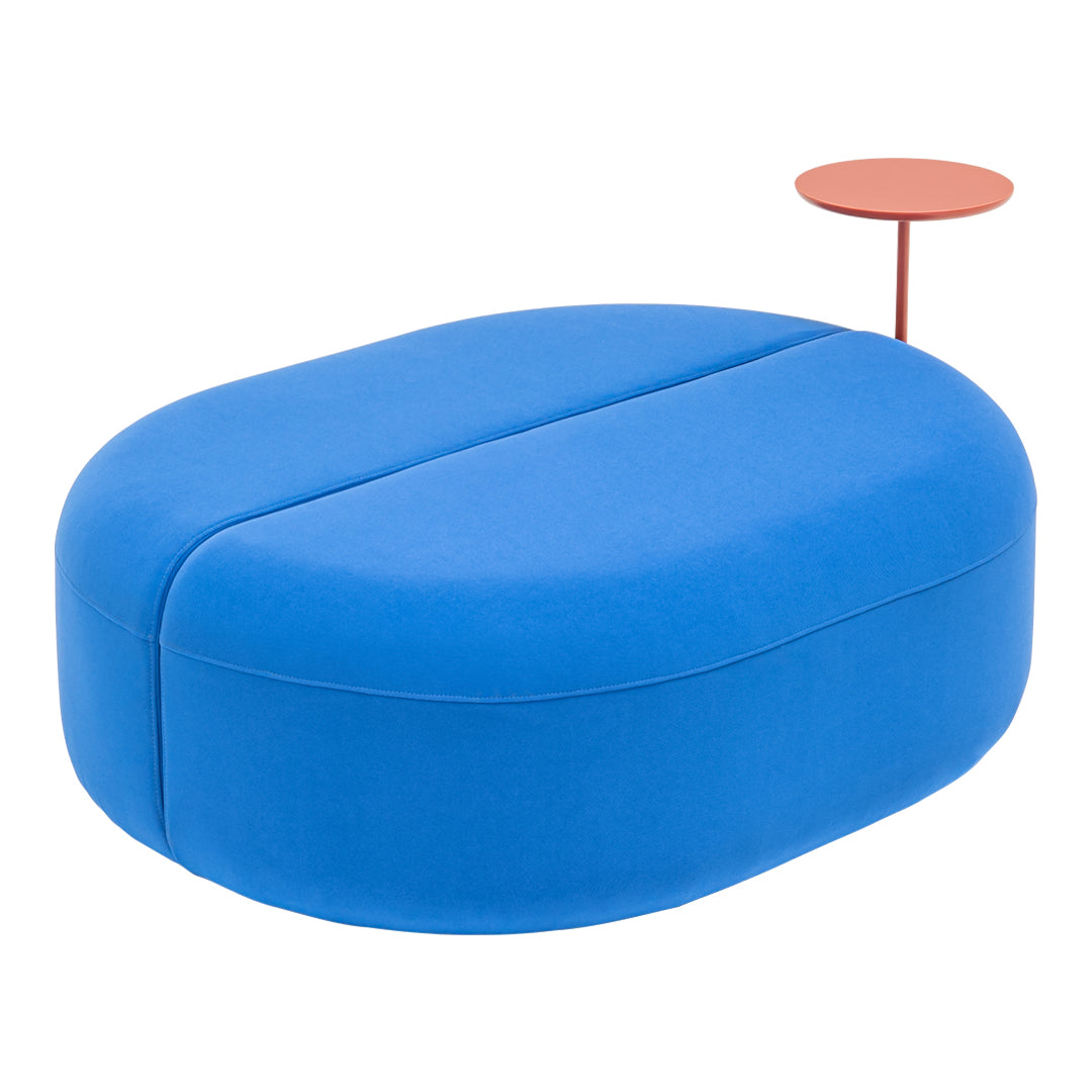 Bright blue upholstered ottoman with smooth, rounded edges and a contrasting red side table. Perfect for modern decor.