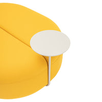 Bright yellow rounded sofa with a sleek white side table for a modern aesthetic. Perfect for vibrant living spaces.