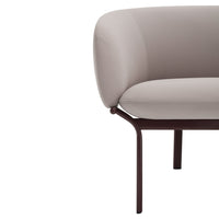 Stylish light beige upholstered sofa with smooth curves and a dark brown metal frame, minimalistic design.
