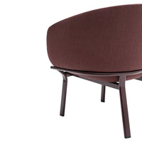 Brown upholstered chair with a smooth, curved design and sleek wooden legs, perfect for modern interiors.