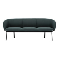 Mid-century modern sofa in deep green upholstery with a sleek black metal frame. Minimalist and stylish design.