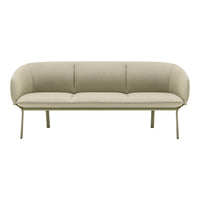 Light beige sofa with smooth, curved lines and a subtle texture, featuring a minimalist design on metal legs.