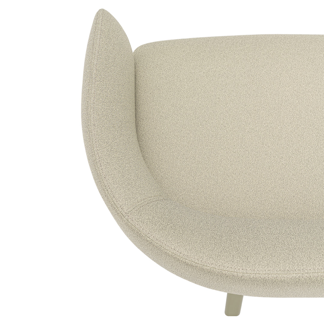 Soft beige upholstered chair with a smooth, textured pattern. Curved design enhances modern aesthetic.