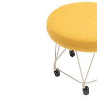 Yellow round ottoman on wheels with a textured fabric and white metal base. Perfect for modern interiors.