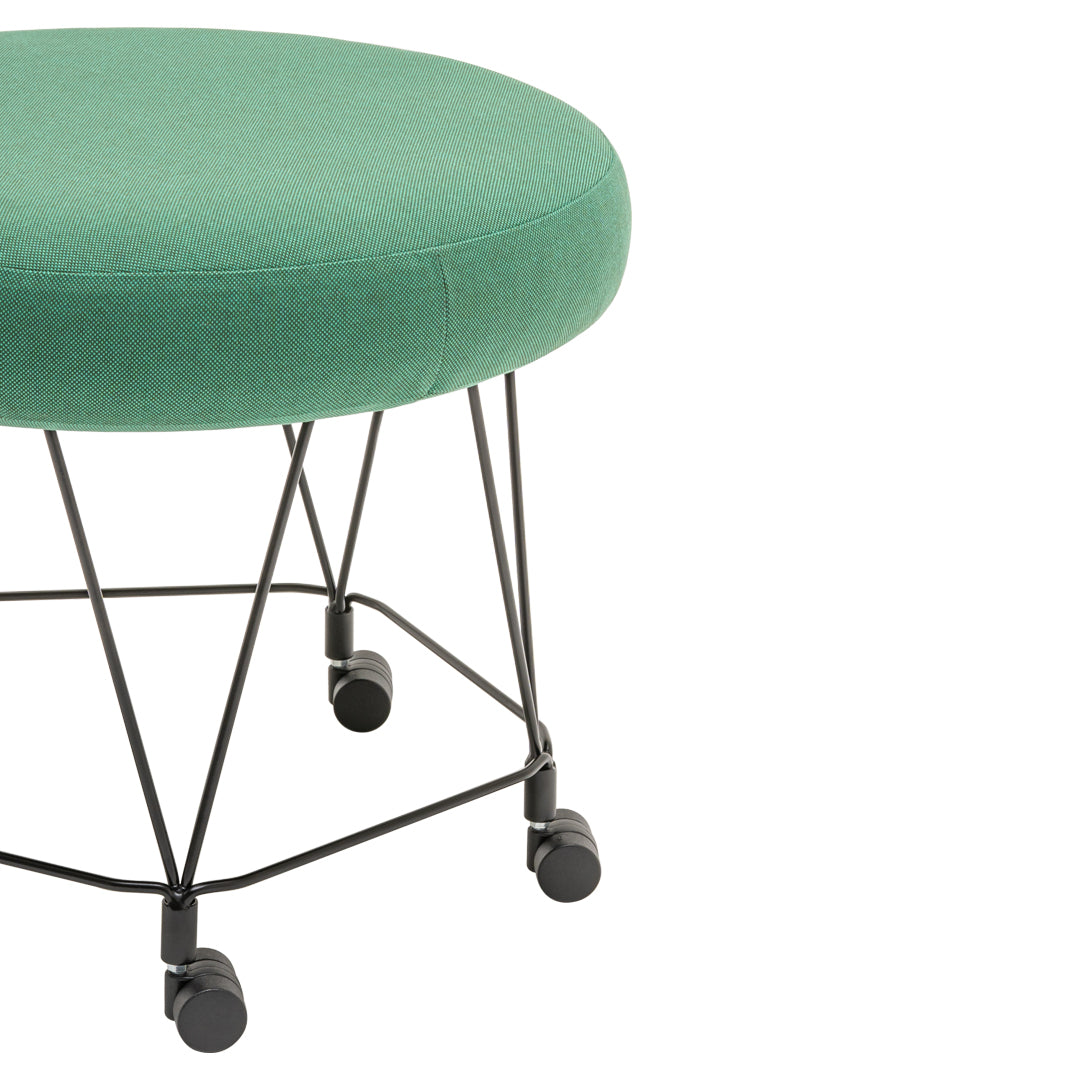 Green upholstered round ottoman with a sleek black metal base and rolling wheels. Perfect for modern decor.