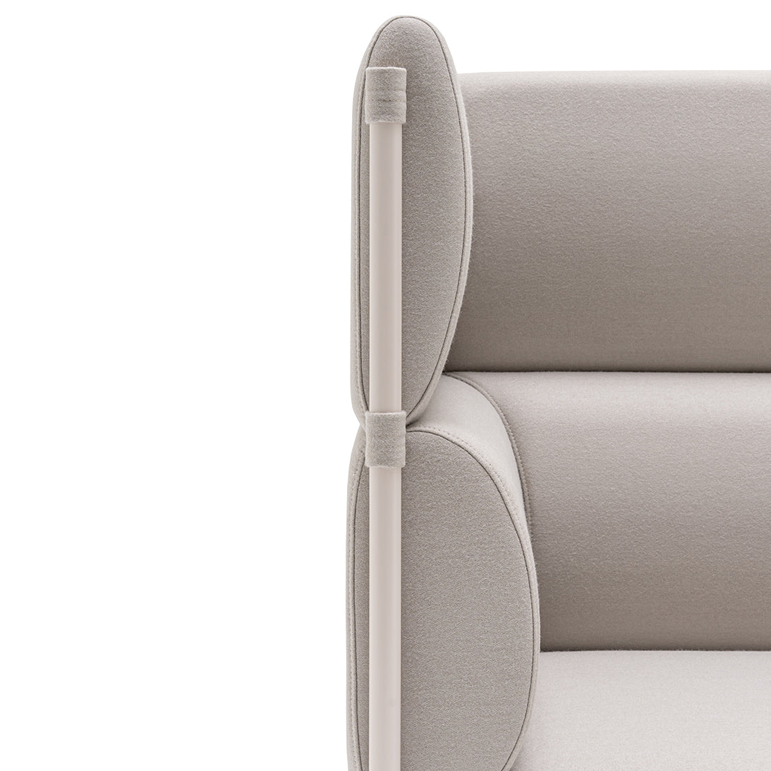 Light beige sofa with smooth, rounded edges and subtle textured fabric accents. Modern and minimalist design.