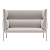 Beige upholstered loveseat with soft, smooth textures and rounded armrests, featuring a minimalist design.