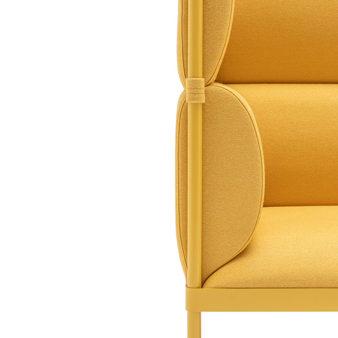 Bright yellow upholstered chair with smooth curves and minimalist design on a sleek yellow metal frame.