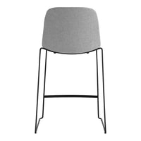 Gray upholstered chair with a sleek black metal frame, featuring a minimalist design and modern aesthetic.
